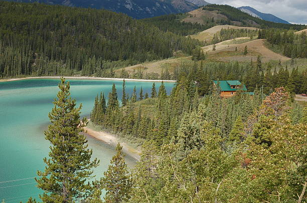 istock Beautiful Lake and Cabin Scene 147664016