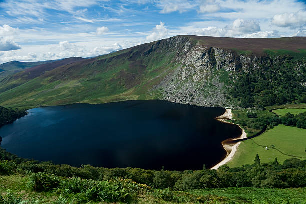 istock Irish landscape with blue sky and lake 147664742