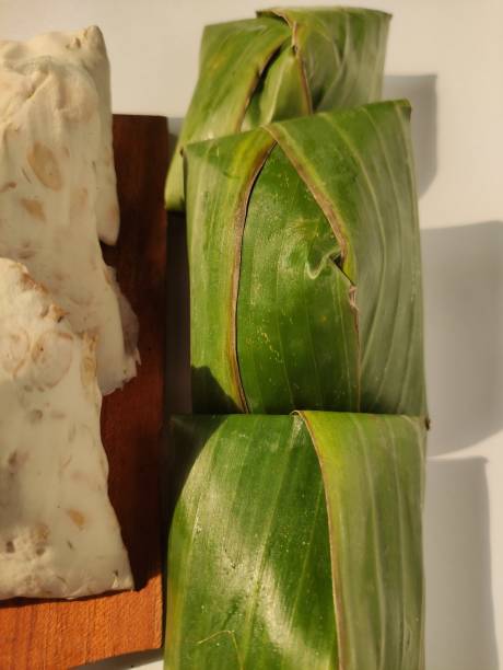 istock Fresh tempeh wrapped in banana leaves. 1476653120