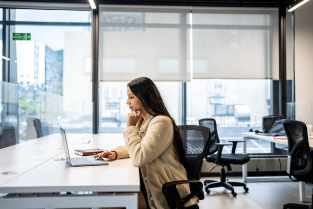istock Young woman working using laptop in the office 1476654092
