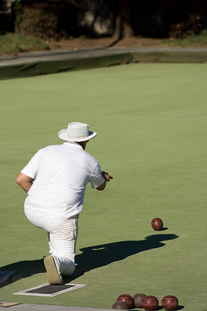 istock lawn bowler aims for the jack 147665701