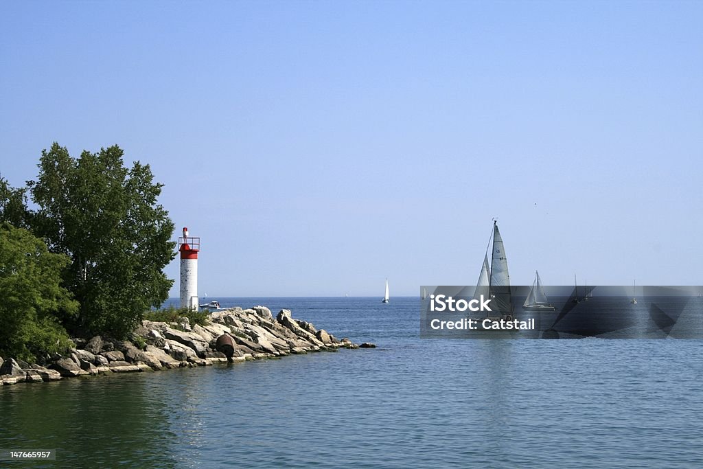 Sea landscape Sea landscape with white light-house and yachts Arranging Stock Photo