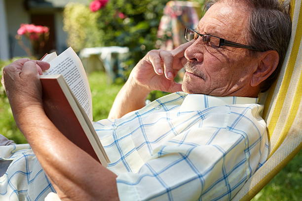 istock Senior Man Reading Outdoor 147666130