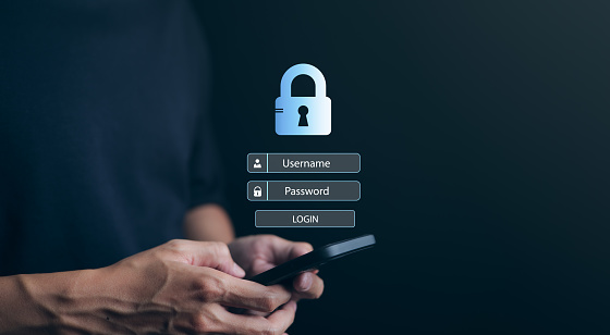 Man using a smartphone to log in with username and password. Cybersecurity concept. information security and encryption, secure access to user's personal information, secure Internet access,