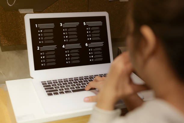 Woman passing online exam. Questionnaire online with checkboxes. Evaluation, Online survey online exam Choosing the right answer in the exam, Test questions. Filling out online survey form business. mujer que aprueba el examen en línea. cuestionario en línea con casillas de verificación. evaluación, encuesta en línea examen en línea elegir la respuesta correcta en el examen, preguntas de prueba. llenado de formulario de encuesta en línea de neg