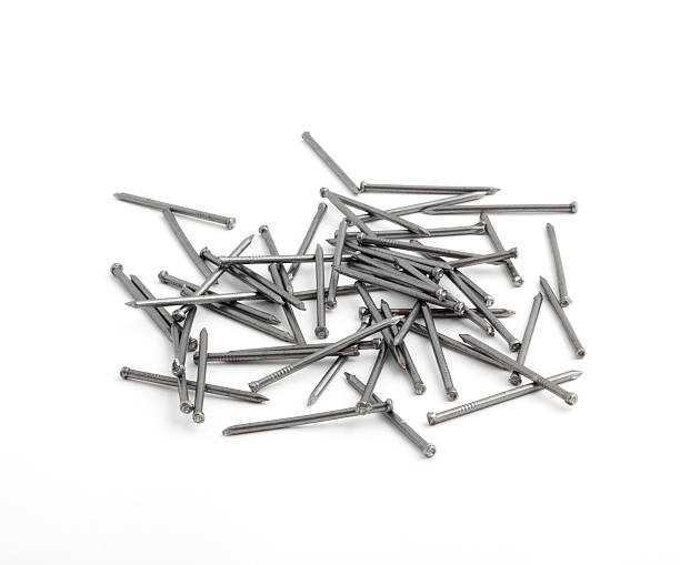 istock pile of nails isolated on white 147666712