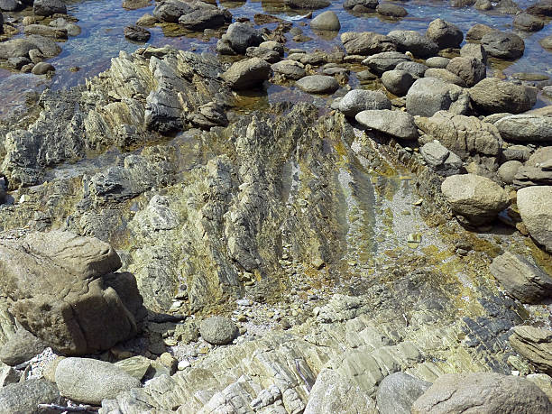 istock Rocks and pebbles on the sea shore. 147667480
