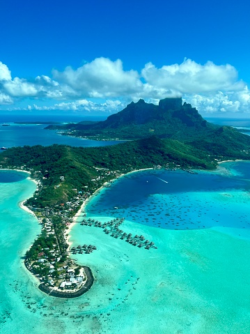 A view on Bora Bora lagoon and Otemanu mountain from helicopter