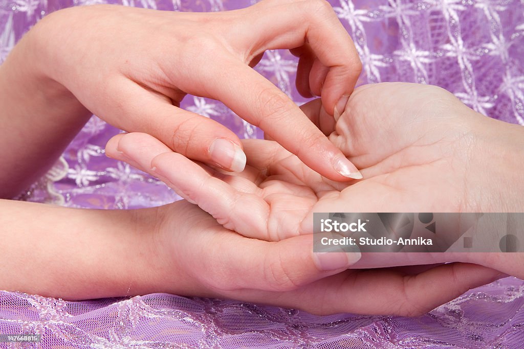 Hand lines Palmistry : hands reading the lines in a woman's hand Adult Stock Photo
