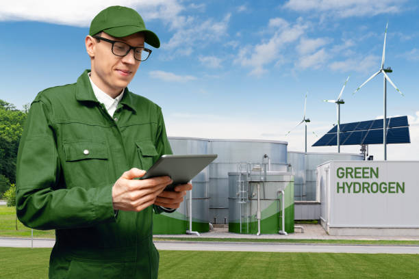 istock Engineer on a background of green Hydrogen factory 1476692213