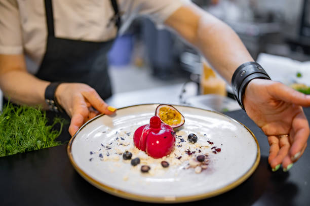 istock Chef cooking Dessert cake with passion fruit on restaurant kitchen 1476692780