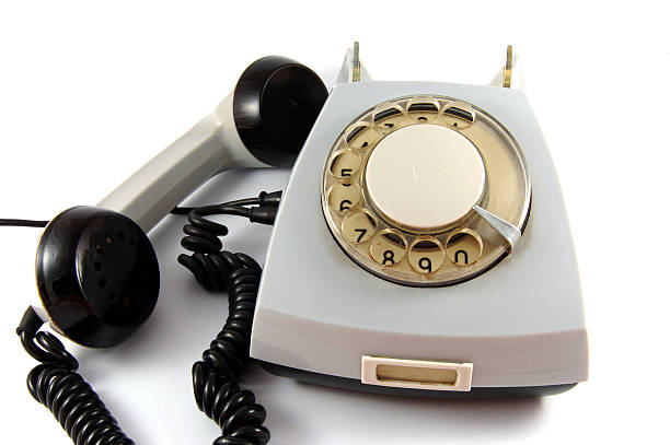 A Retro Vintage Rotary Telephone On A Wooden Desk With Copy Space