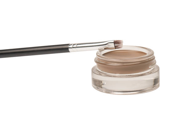 istock A brow pomade in blonde shade with brush isolated on a white background. 1476694255