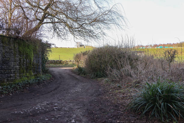 istock Dirt road access point into Oakworth Park, Keighley, Yorkshire 1476694318