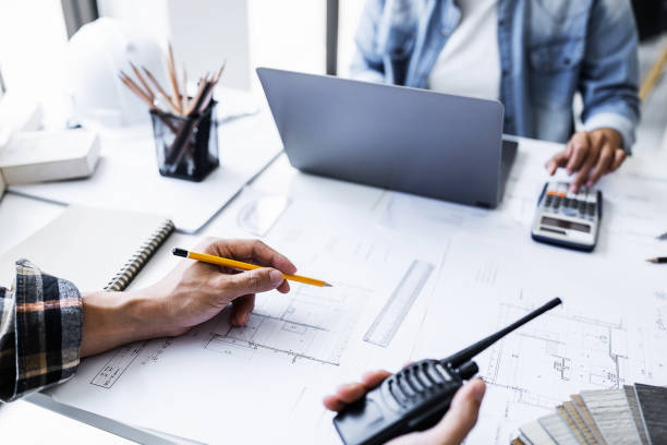 istock Close up of engineer meeting for architectural project. working with partner and engineering tools on workplace 1476697373