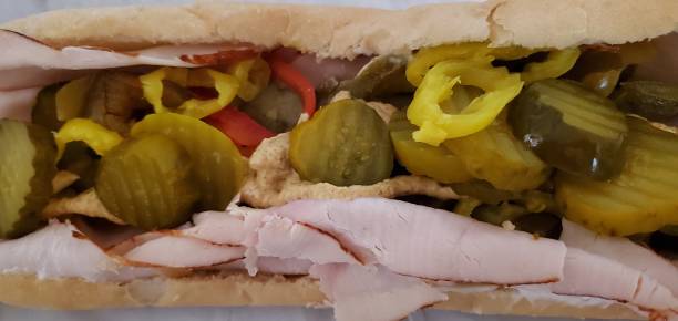 Turkey hoagie with pickles sweet pepper and banana peppers stock photo