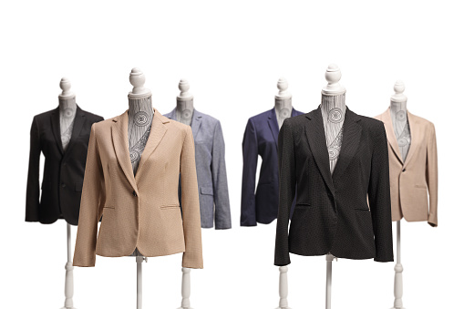 Studio shot of torso mannequins dressed with suits isolated on white background
