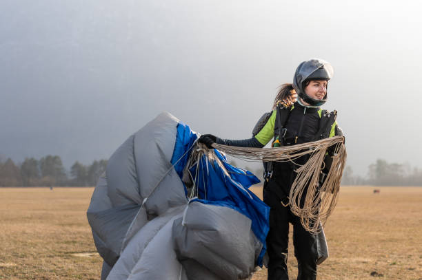 istock Skydiving woman touches the ground. 1476704596