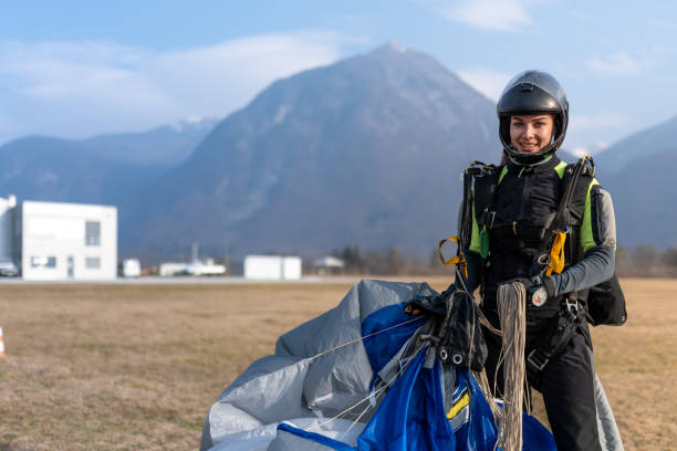 istock Skydiving woman touches the ground. 1476704616