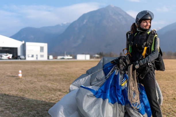istock Skydiving woman touches the ground. 1476704629