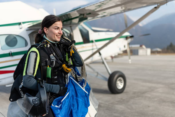 istock Skydiving woman touches the ground. 1476704645