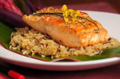 Fillet of broiled salmon on rice, garnished Hawaiian style
