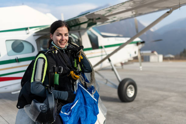 istock Skydiving woman touches the ground. 1476704653