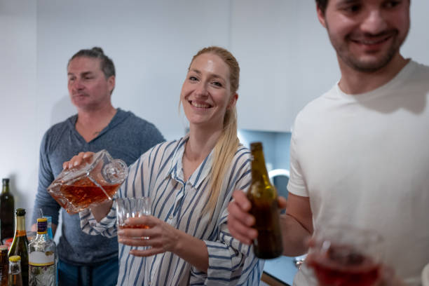 istock A middle-aged couple, a woman serving whiskey 1476704836