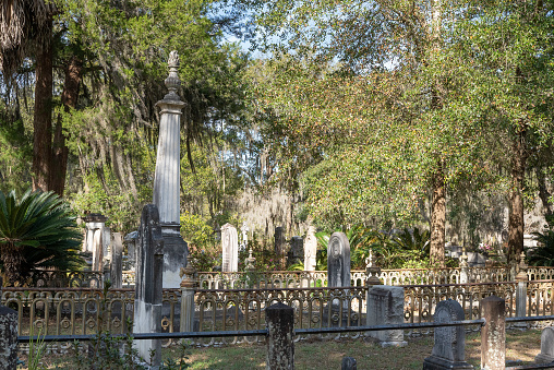 A sunny day in an old cemetery with ruined ornamental tombs - Lafayette Cemetery No. 2 in New Orleans.