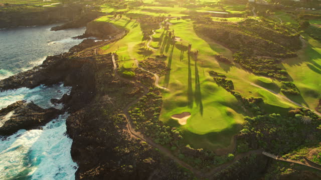 Aerial view of a golf club field at sunset on Tenerife Island, Spain.