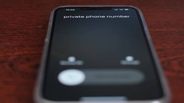 Incoming call of a private number on the smartphone screen. Unknown calls from scammers. stock photo