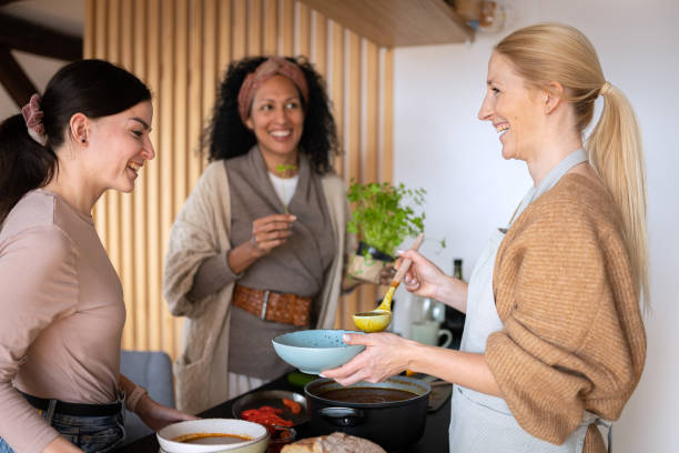 istock Friends prepare and cook lunch 1476710709