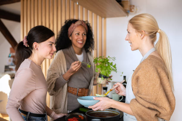 istock Friends prepare and cook lunch 1476710741