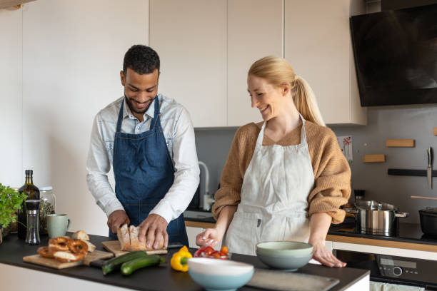 istock Friends prepare and cook lunch 1476710764