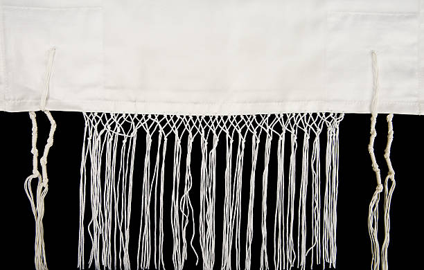 Jewish Prayer Shawl A jewish prayer shawl, or tallit, showing the fringes, called tzitzit jewish prayer shawl stock pictures, royalty-free photos & images