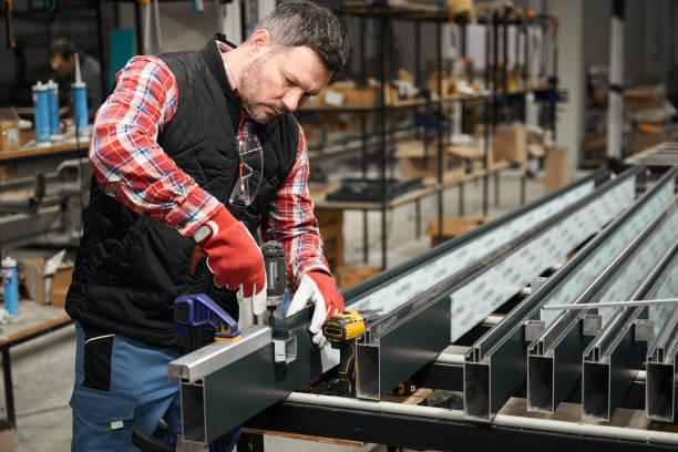 istock Adult male assembling metal structure in workshop 1476714138