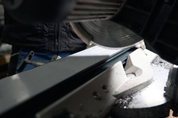 istock Man standing near machine cutting steel structure machine 1476714250