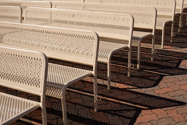 istock Metal benches and their shadows 1476714904