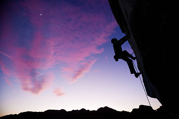 istock Rock climber clinging to an overhang. 147671642
