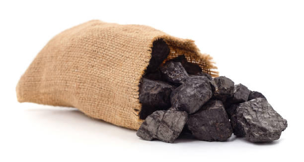 Coal in a bag. Coal in a bag isolated on a white background. hard bituminous coal stock pictures, royalty-free photos & images