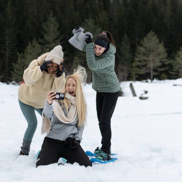 istock Friends on a hike through a snowy valley. 1476722907