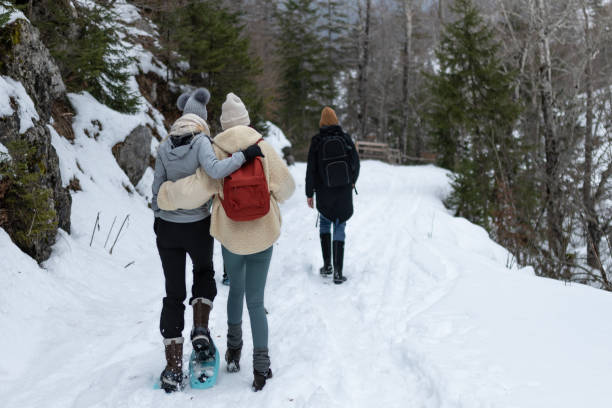 istock Friends on a hike through a snowy valley. 1476722937