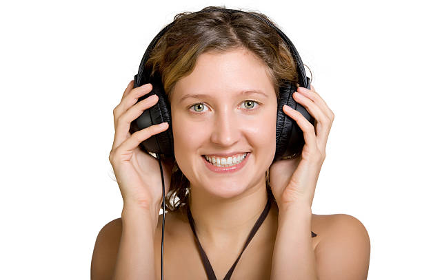 young women  listen  the music stock photo