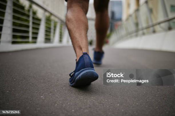 Fitness Legs Or Runner Walking On A City Bridge In A Warm For Training Cardio Exercise Or Calf Muscle Workout Wellness Zoom Or Sports Athlete Trekking Or Exercising With Running Shoes Or Footwear Stock Photo - Download Image Now