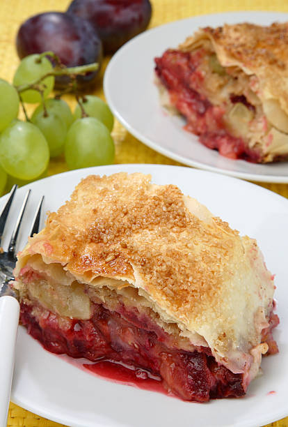 istock Piece of plum strudel on plate 147672691