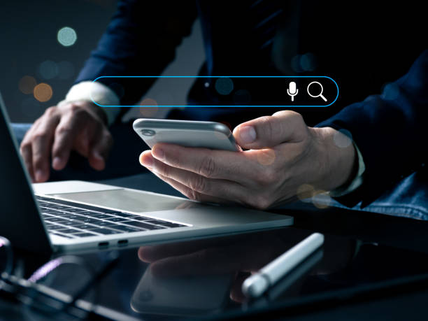 istock A sign for the Search Engine Optimization SEO Networking Concept is pointed out by the man.using a search box that is empty to search an internet data information browser. 1476727881
