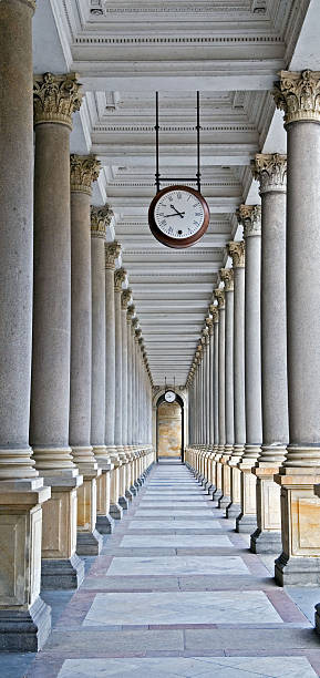 Classical columns and clock stock photo