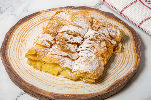 Greek pastry Bougatsa with phyllo dough and semolina custard cream. 26 March
