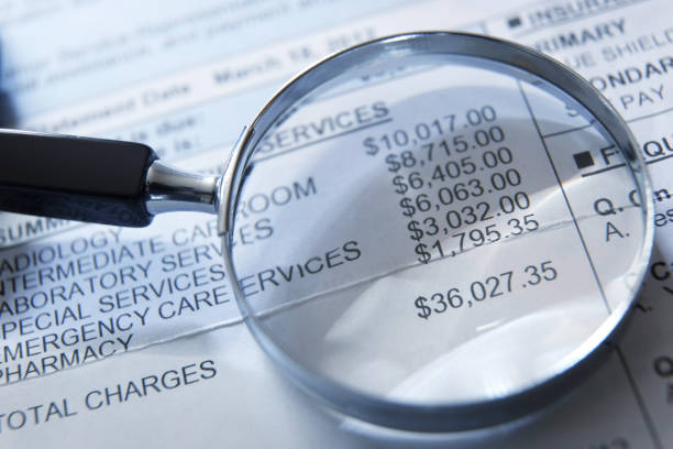 Magnifying Glass On A Medical Invoice stock photo