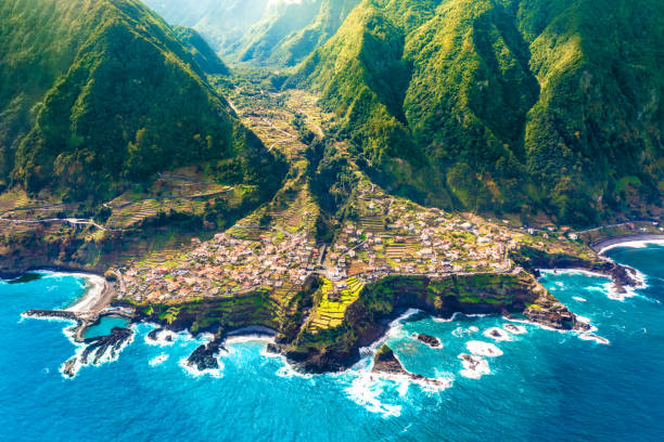 aerial view of madeira island. land meets ocean in seixal, madeira, portugal - madeira island imagens e fotografias de stock